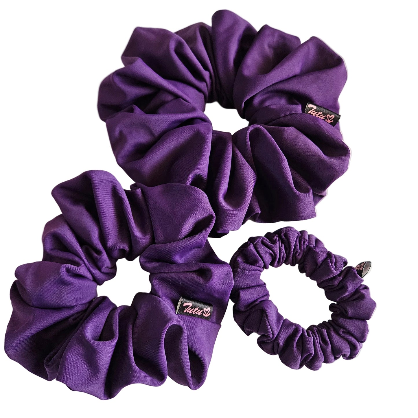 Three plum lycra swim scrunchies