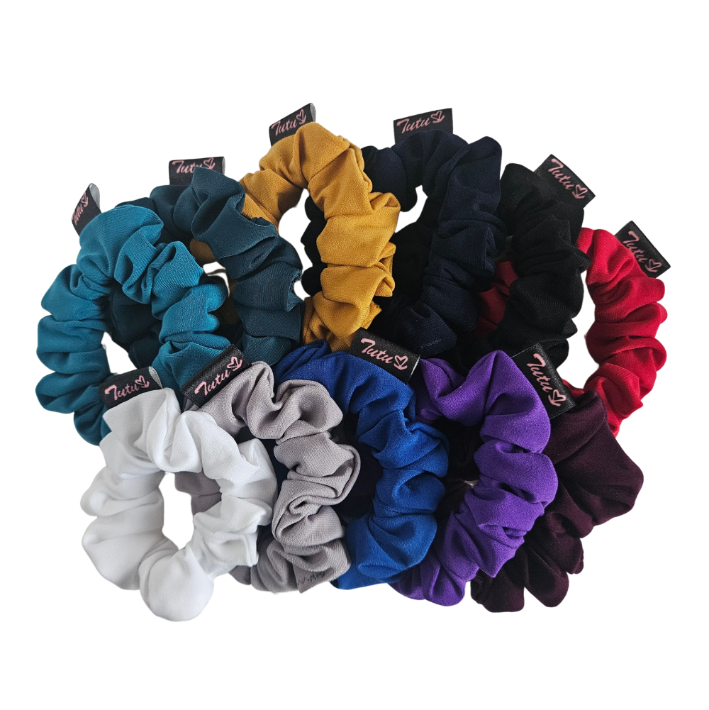A set of 11 hair scrunchies in assorted colorsarranged in a fan shape on a plain white background. Each scrunchie has a small black fabric tag with the brand name 'Tutu22' printed on it.
