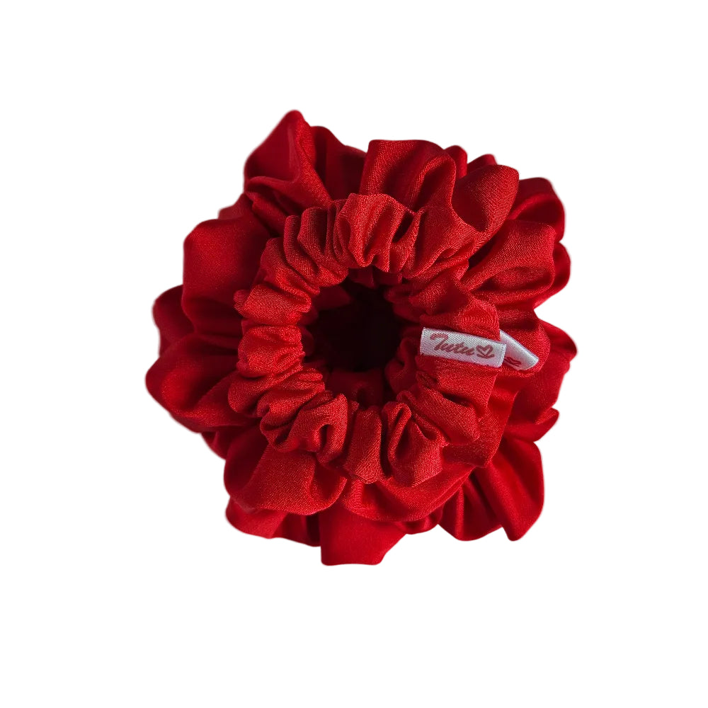 stack of red lycra swm scrunchies